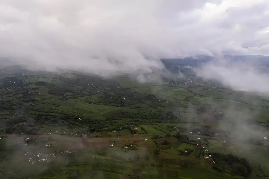 Mist over green hills near Karatu