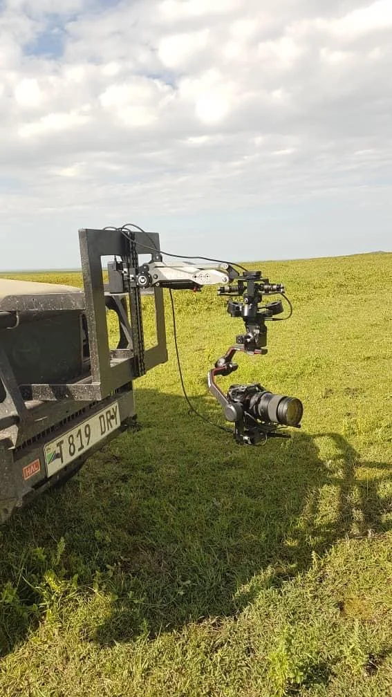 camera mounted on a land cruiser safari vehicle in serengeti