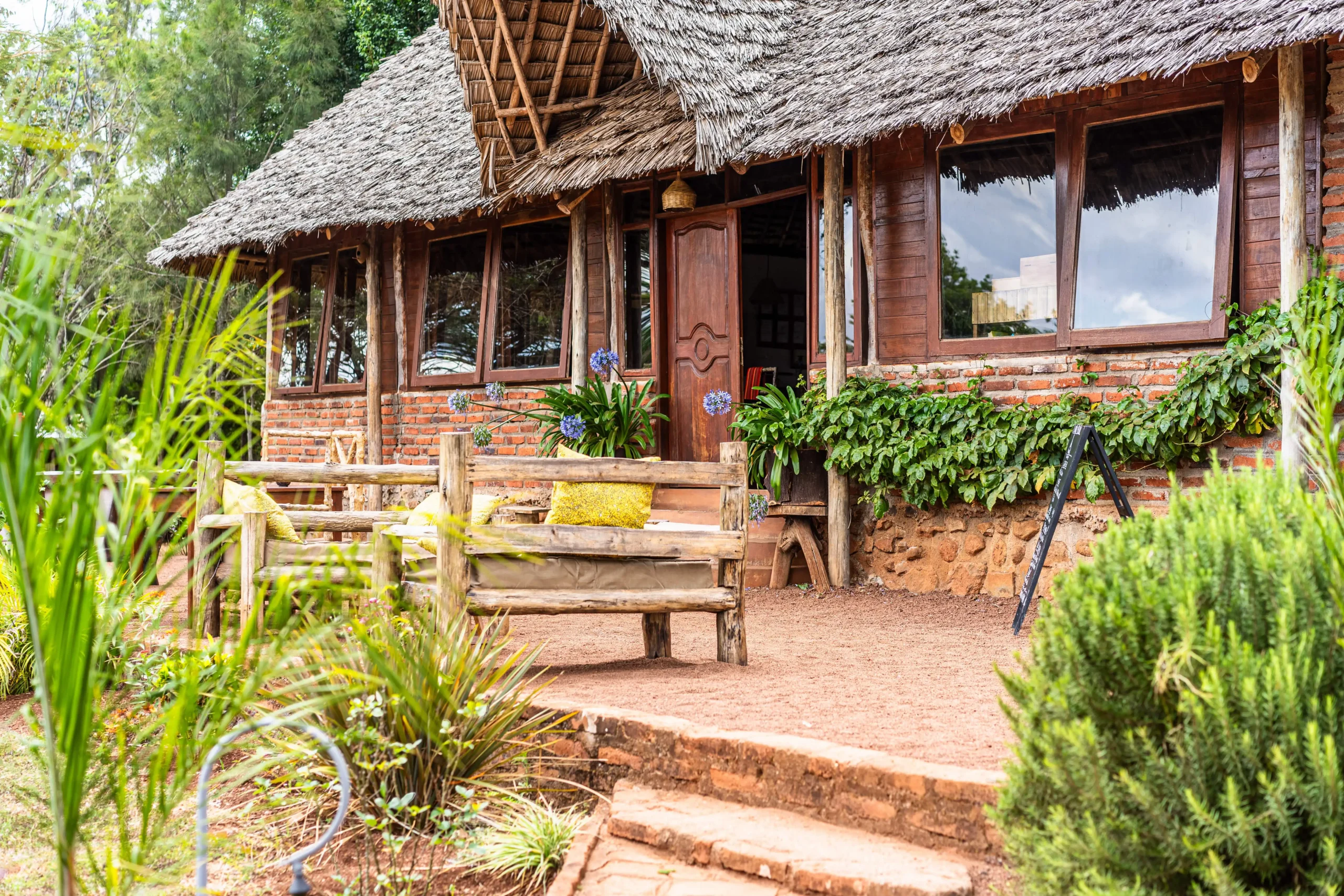 Wooden veranda and garden at Karatu Tented Lodge
