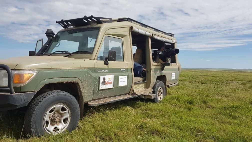 land cruiser filming vehicle in serengeti tanzania