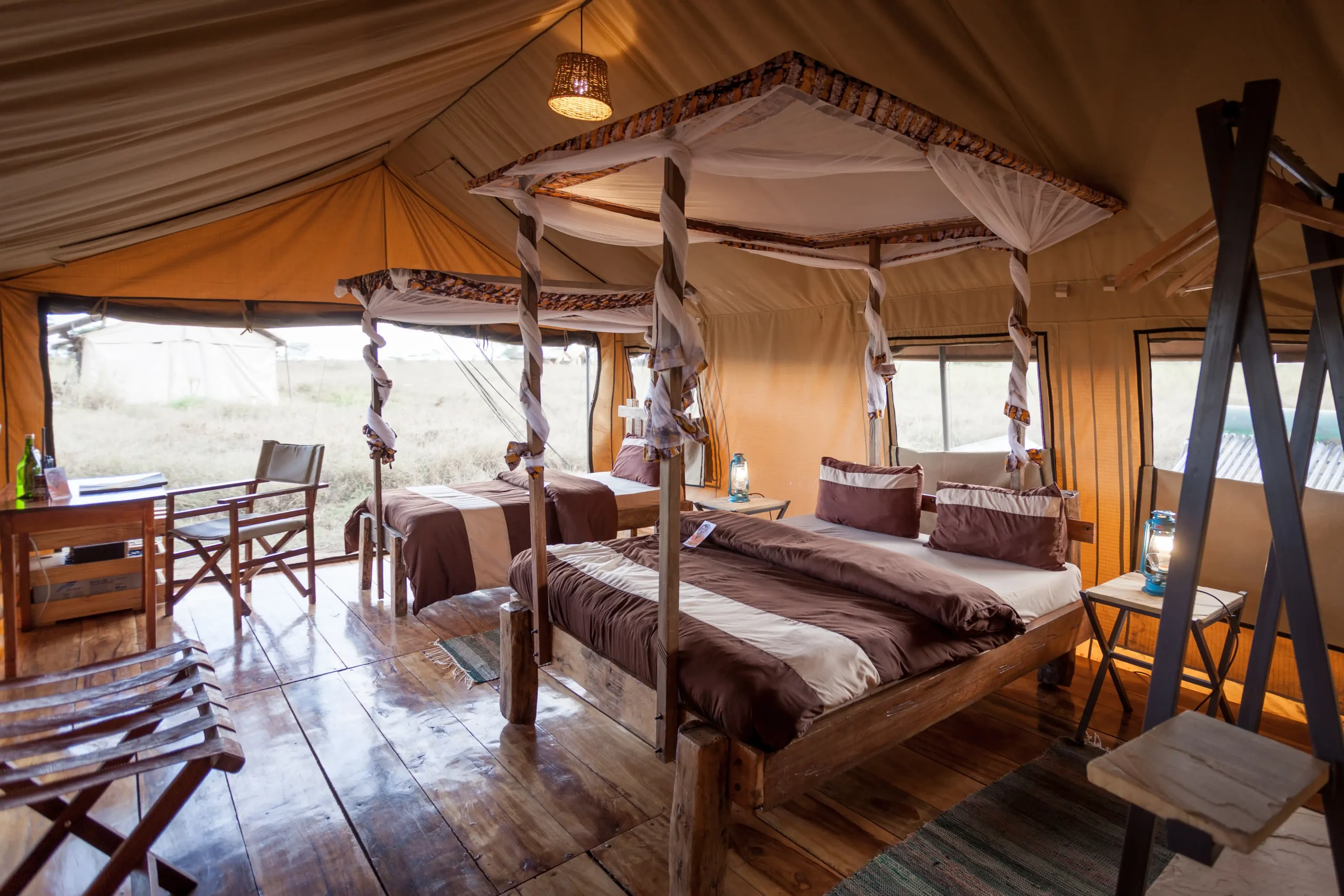 Guest tent interior with beds and seating at Mawe Tented Camp