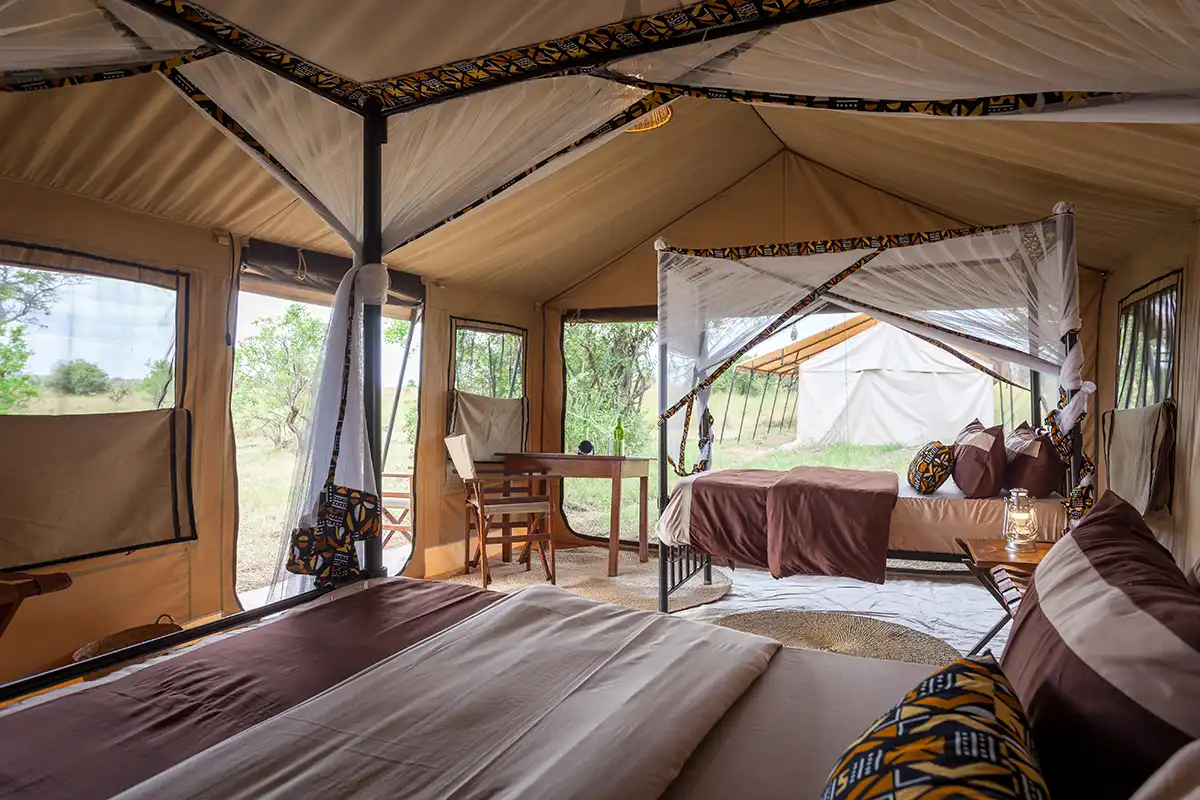 Twin beds in a guest tent at Gnu Mara River Camp
