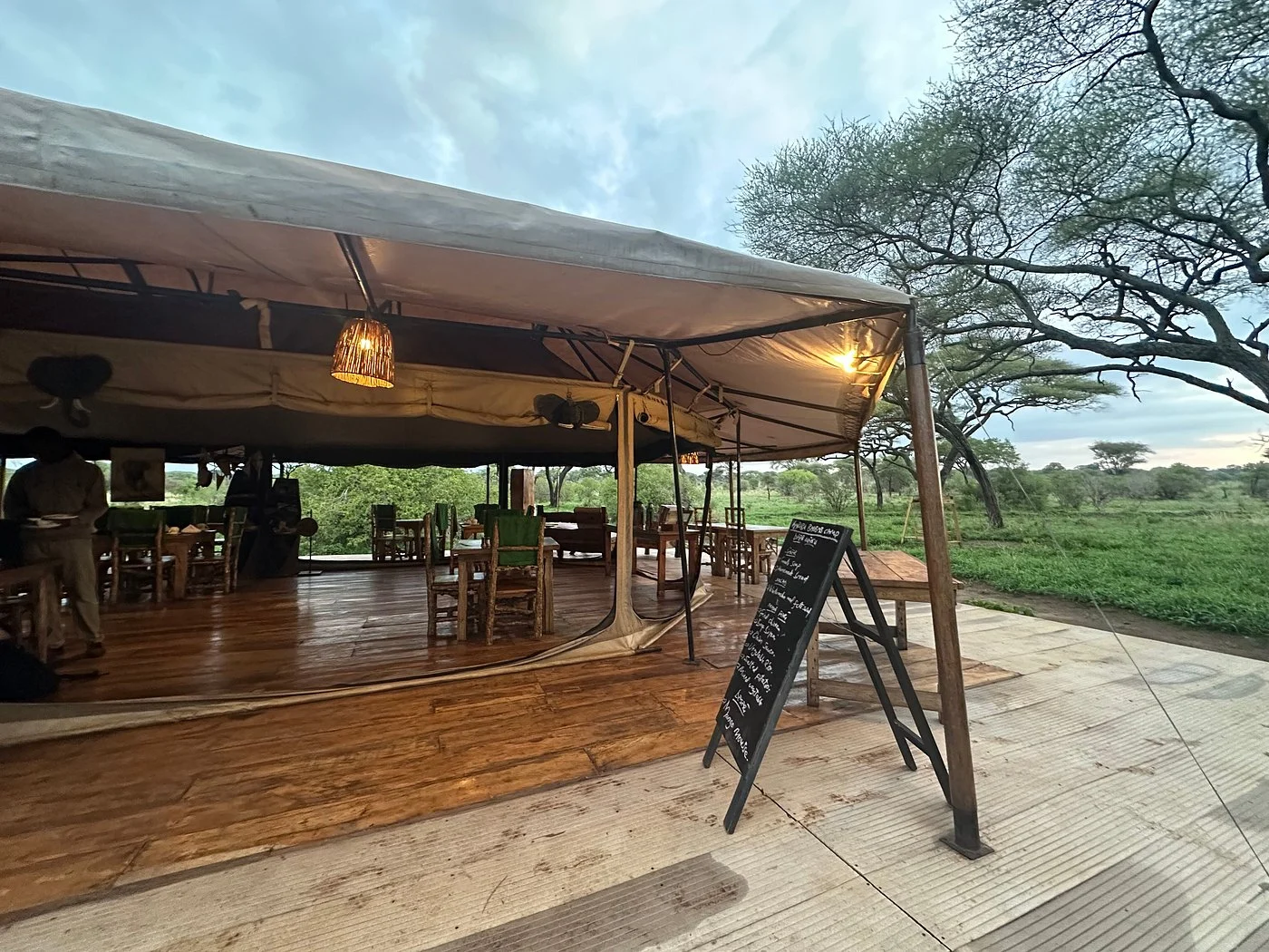 The open-sided mess tent and wooden deck at Baobab Tented Camp