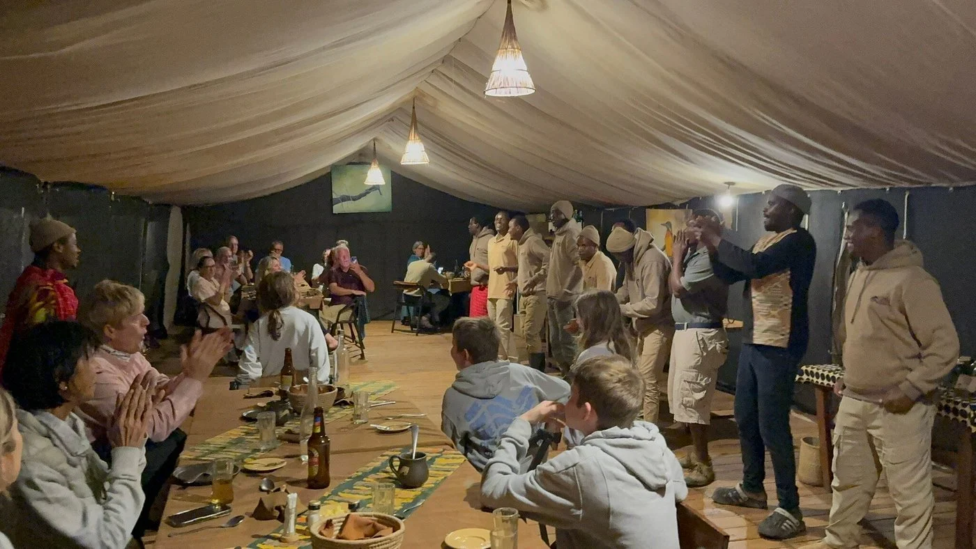 Guests and staff gathered for dinner in the mess tent