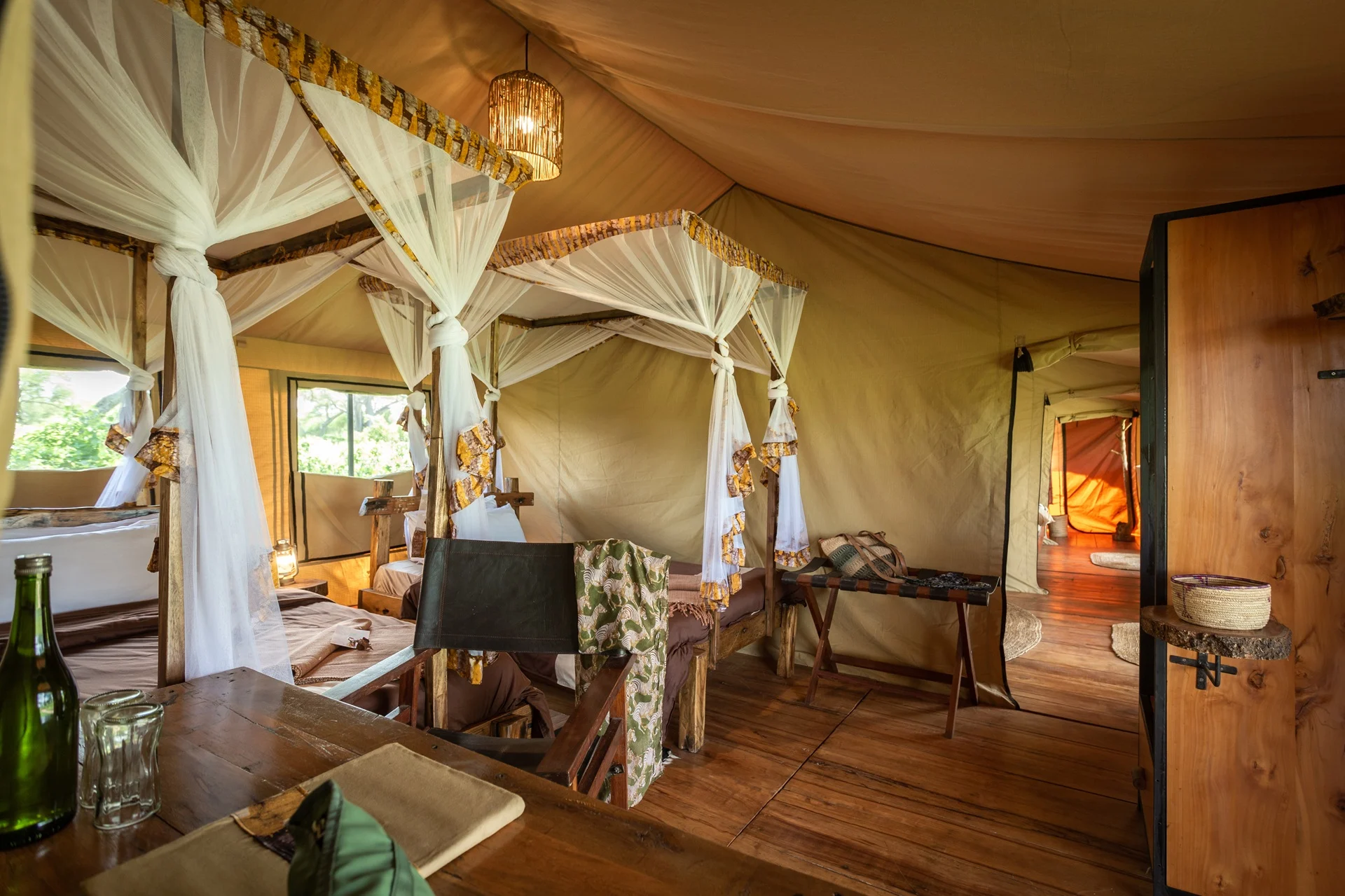 Family safari tent interior with twin beds