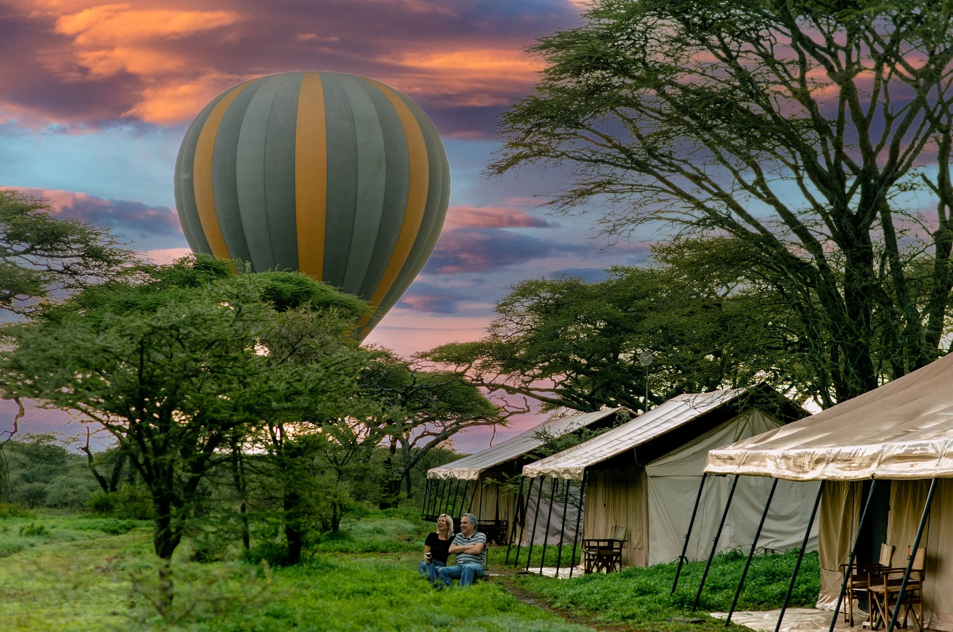 A hot air balloon drifting over the plains above Gnu Ndutu Camp