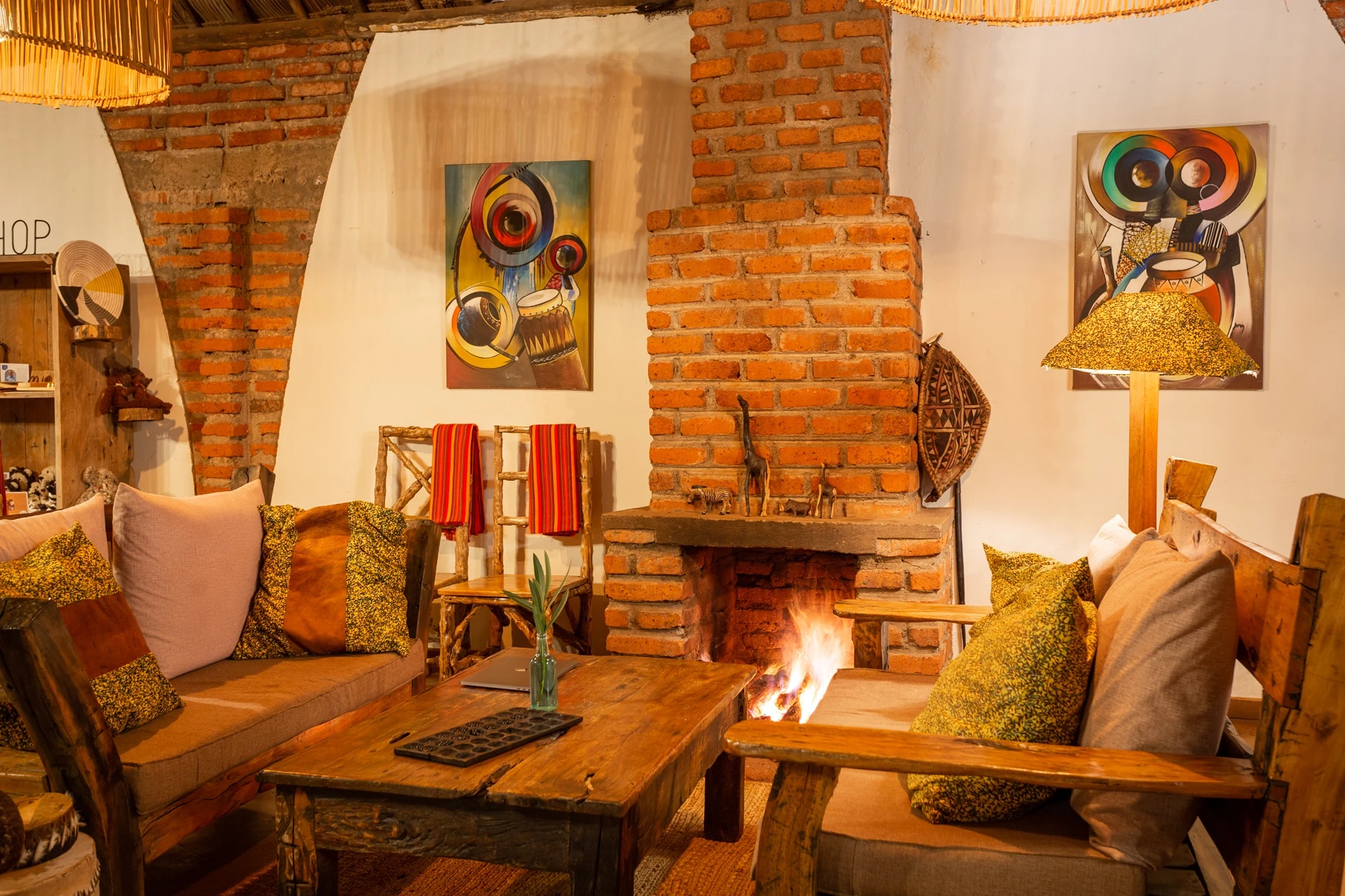 Karatu Lodge lounge brick fireplace seating area