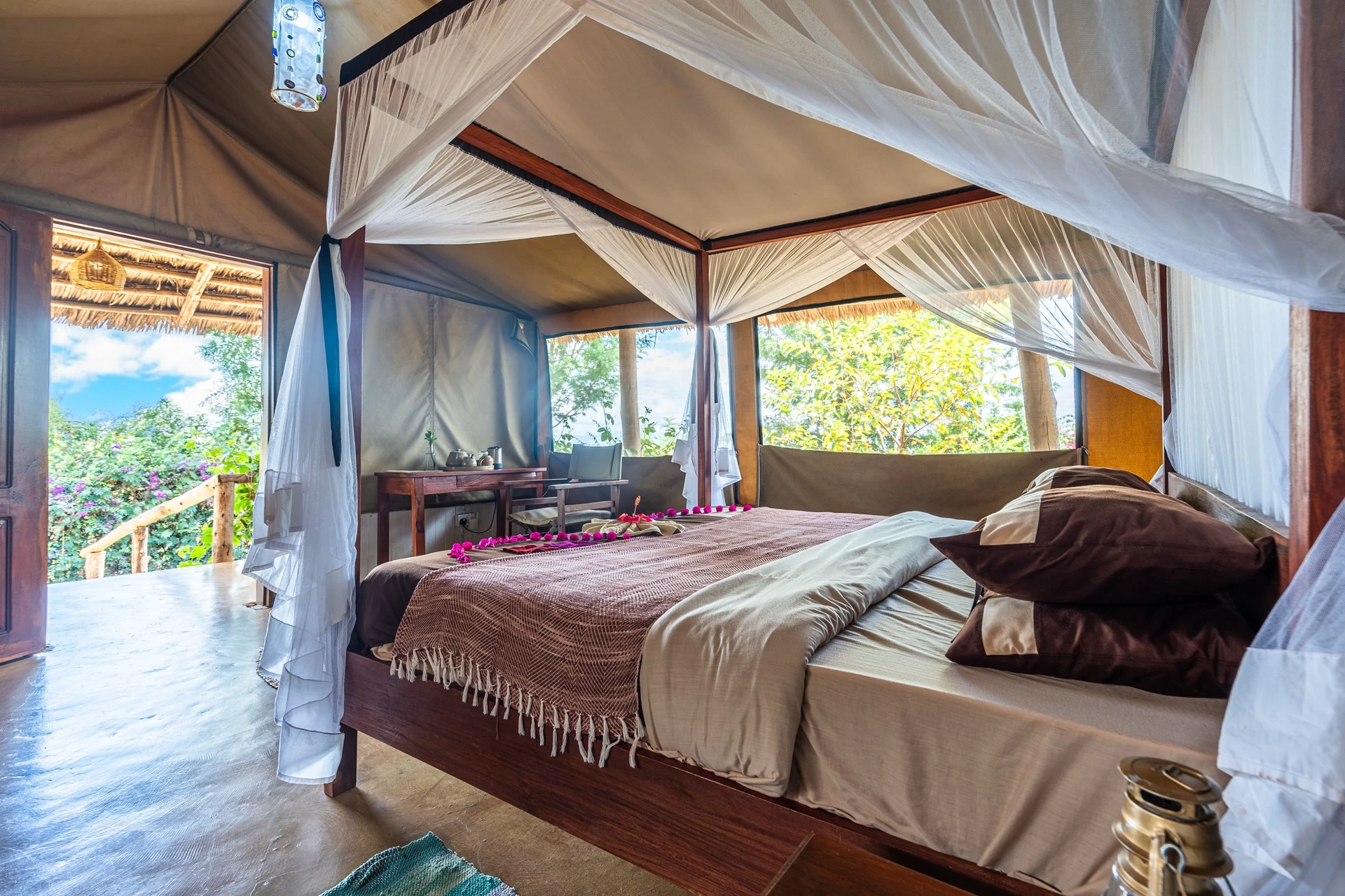Karatu Lodge luxury tent canopy bed bougainvillea view