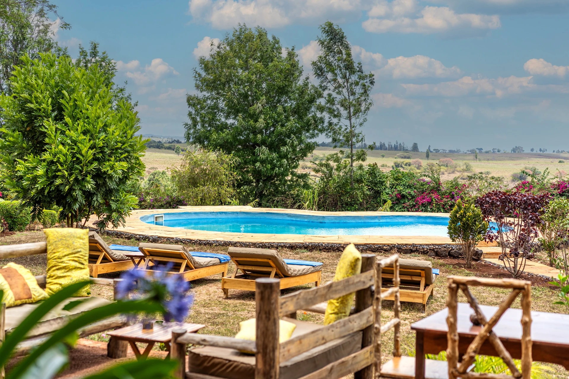 Karatu Lodge swimming pool loungers Tanzania views