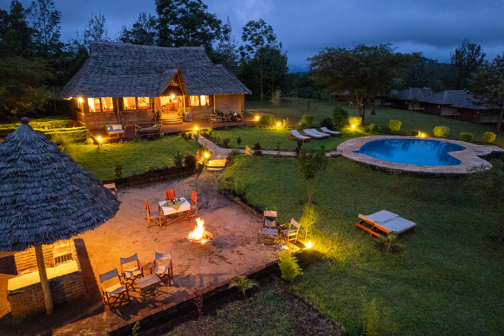 Karatu Tented Lodge aerial view pool bonfire night