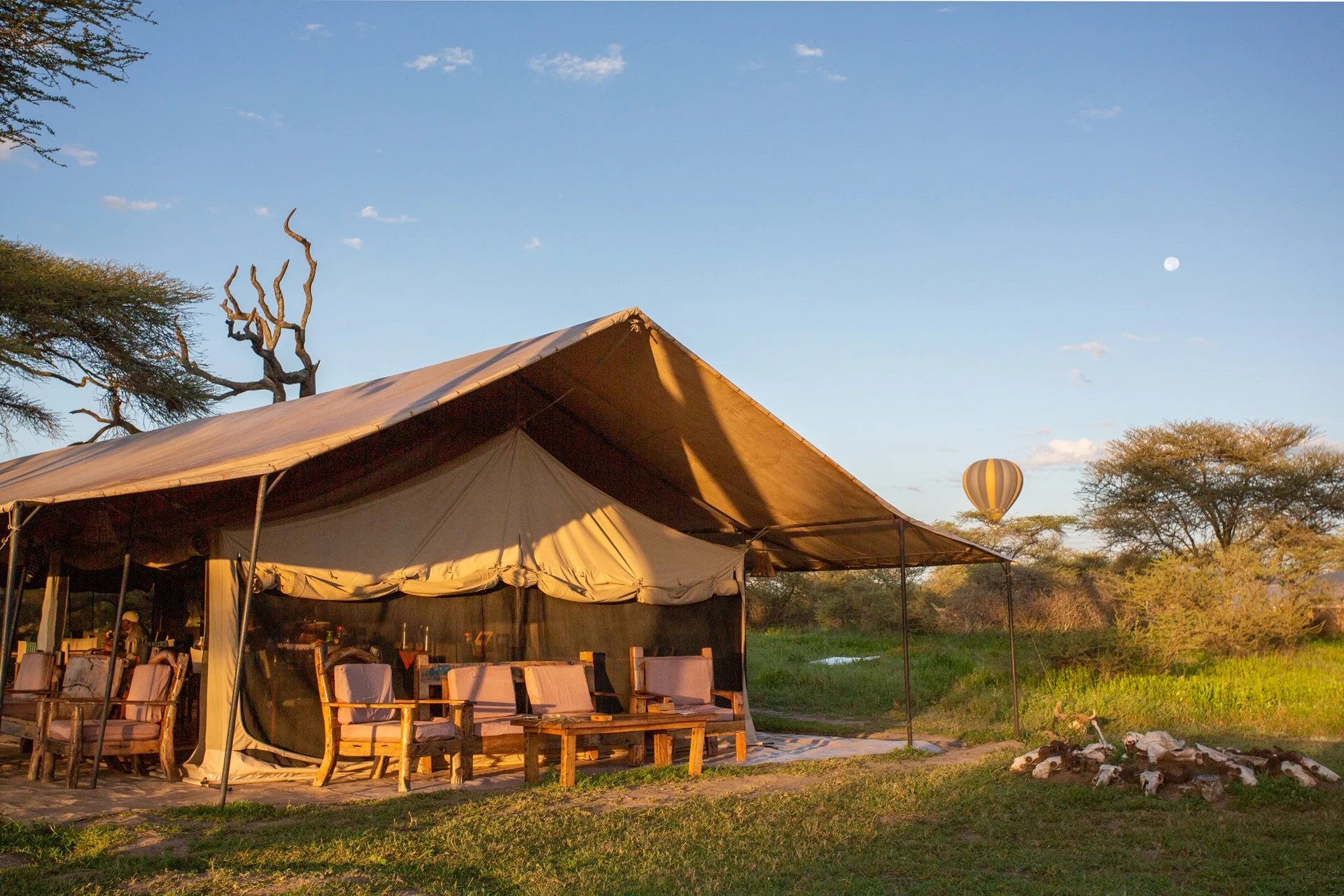 Sofas and armchairs in the main tent lounge at Gnu Ndutu Camp