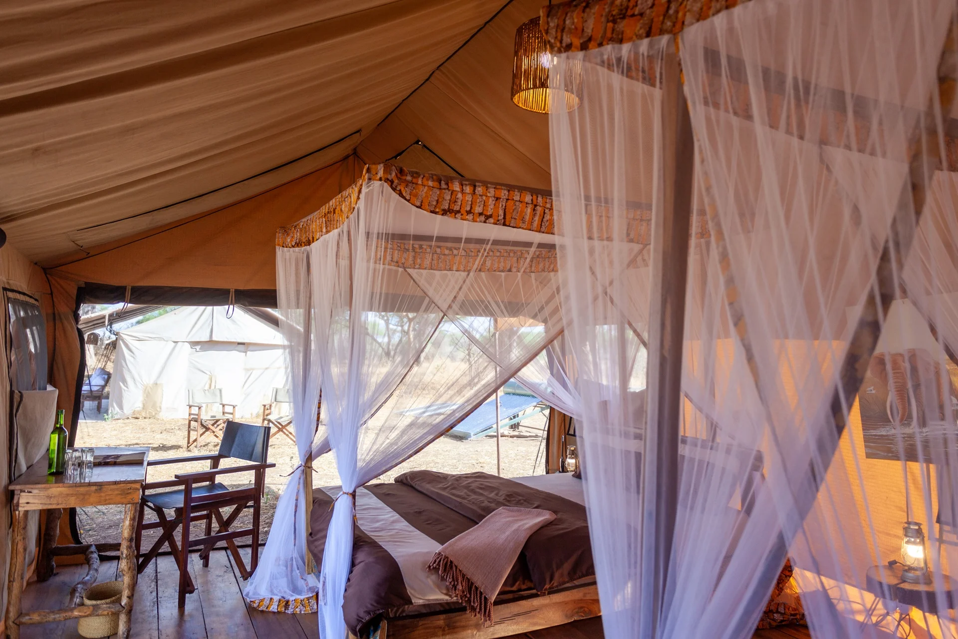 Twin room with mosquito net at Baobab Tented Camp