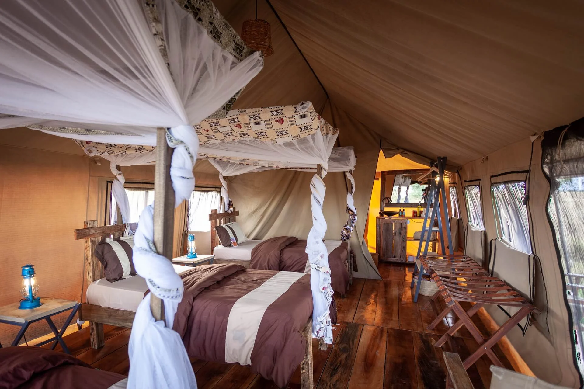 Twin beds under mosquito nets in a safari tent